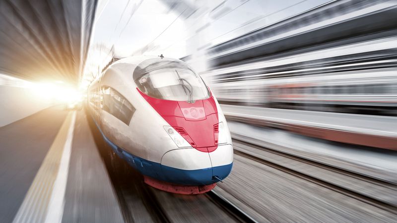 High-speed-train-in-motion-in-the-railway-station-at-sunset_59067.jpg